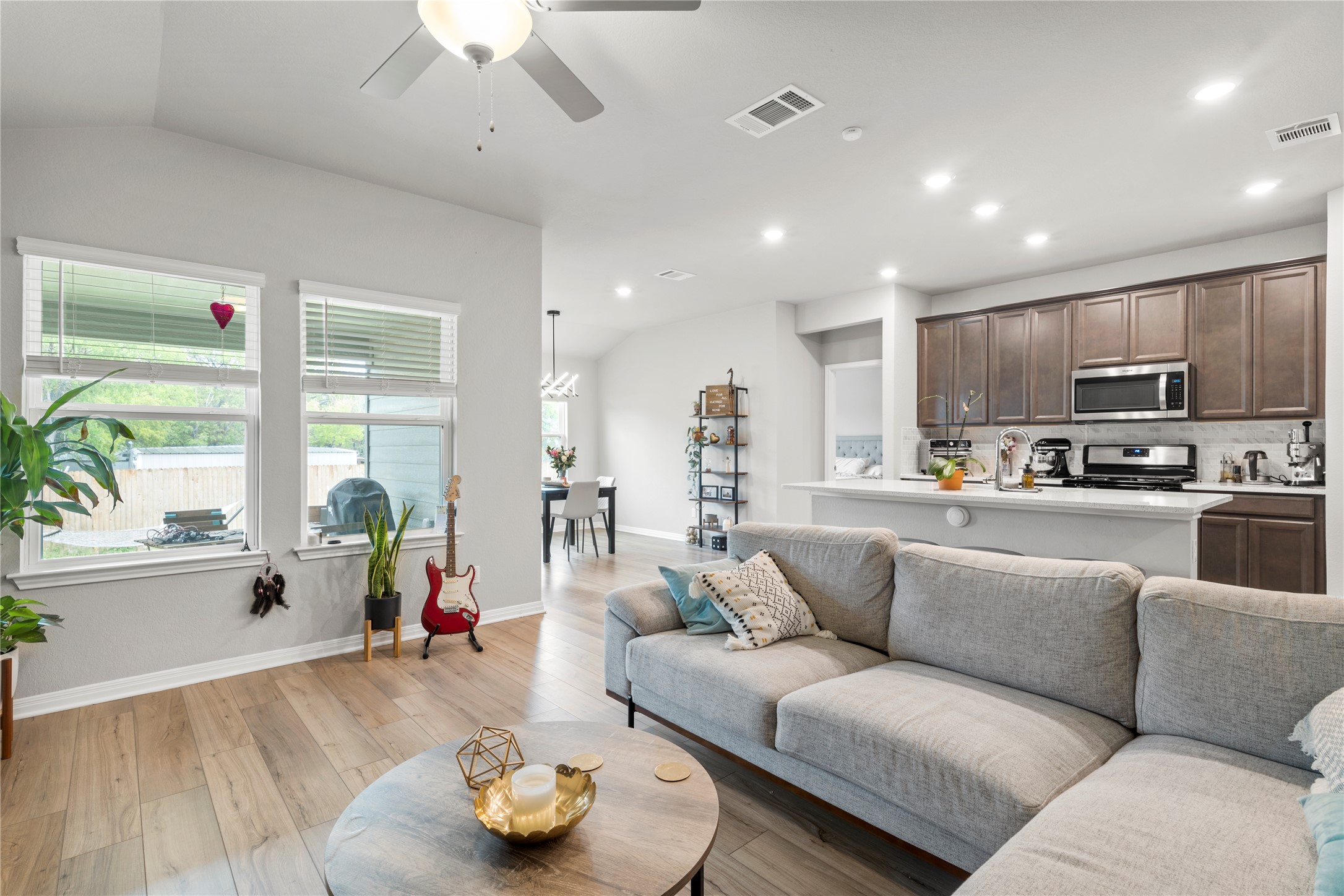 11701 Copperstone Avenue Austin, TX 78748 - Photo 9 of 29 Living room featuring ceiling fan, lofted ceiling, light wood-type flooring, and recessed lighting