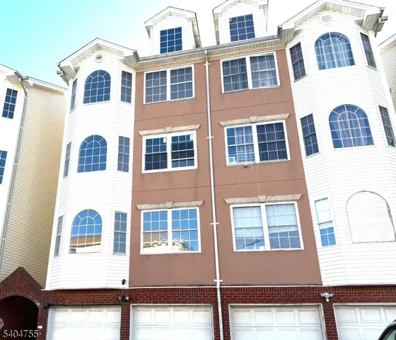 a view of a building next to a road