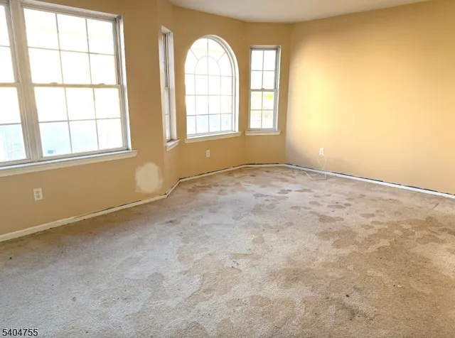 a view of a room with large windows