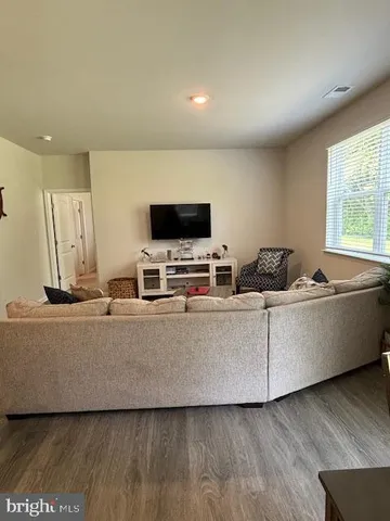 a view of a dining room with furniture and window