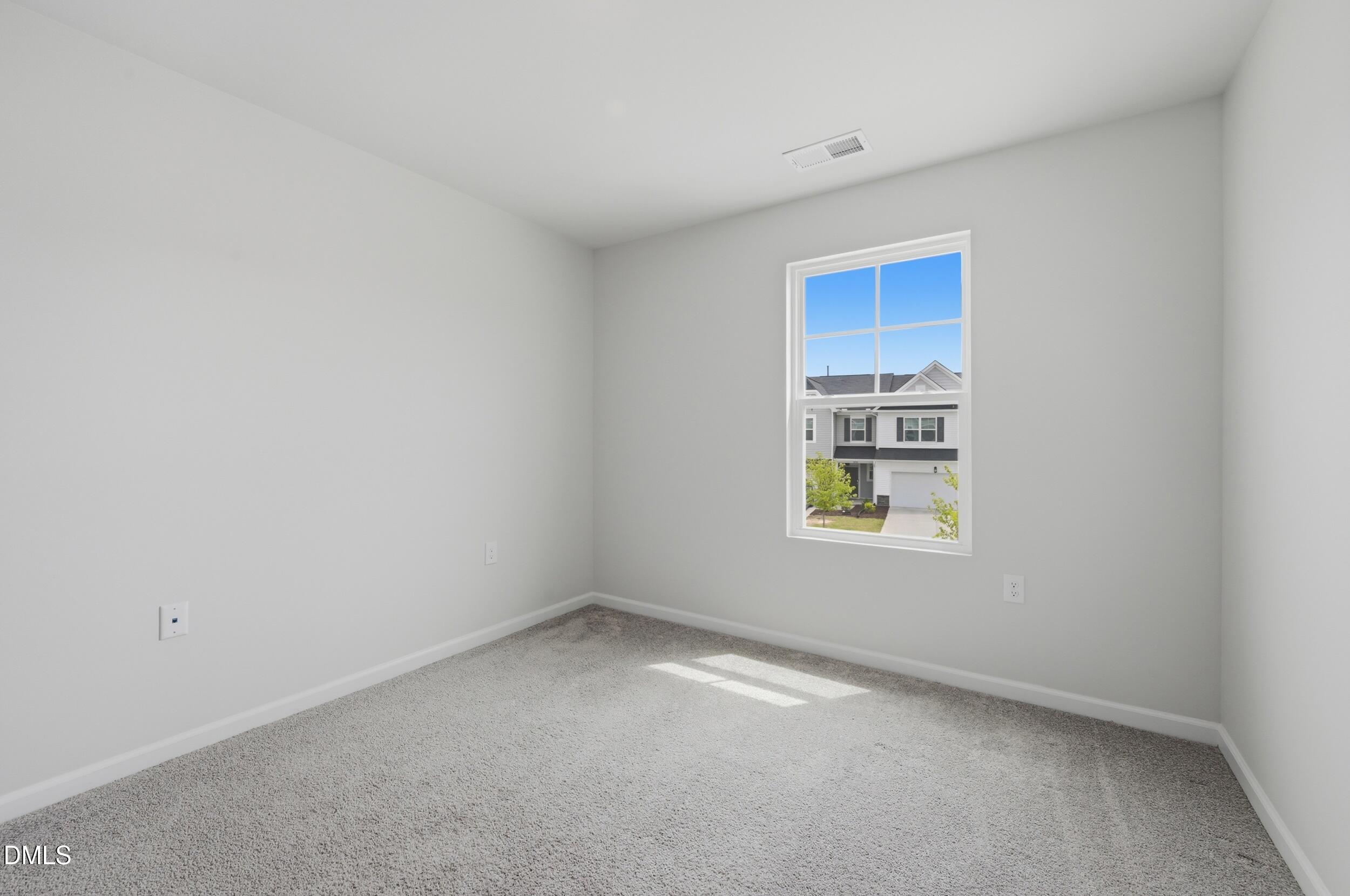 5011 Kota Street Raleigh, NC 27610 - Photo 18 of 42 a view of an empty room with a window