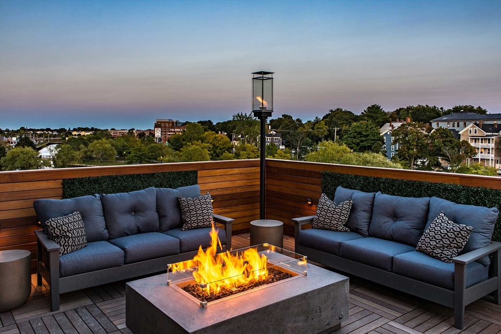 72 Flint Street, Unit 3102 Salem, MA 01970 - Photo 13 of 15 a view of a roof deck with couches and sky view