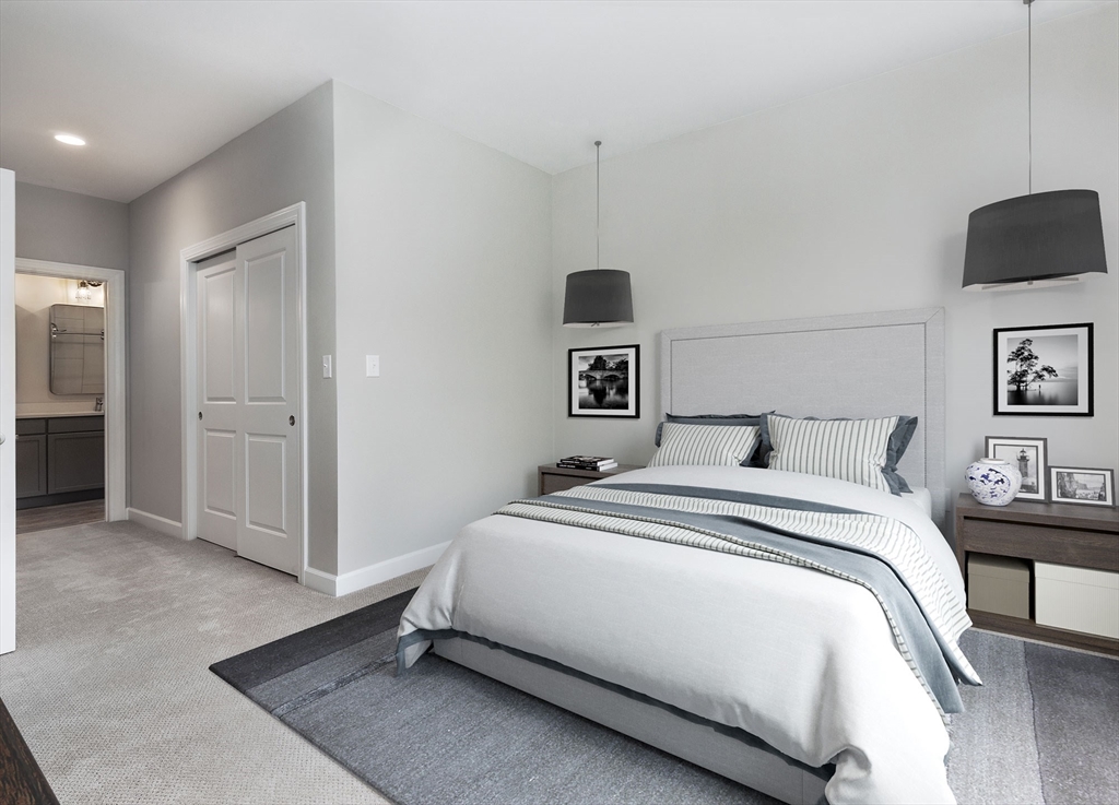 72 Flint Street, Unit 3102 Salem, MA 01970 - Photo 3 of 15 a spacious bedroom with a bed and a view of bathroom