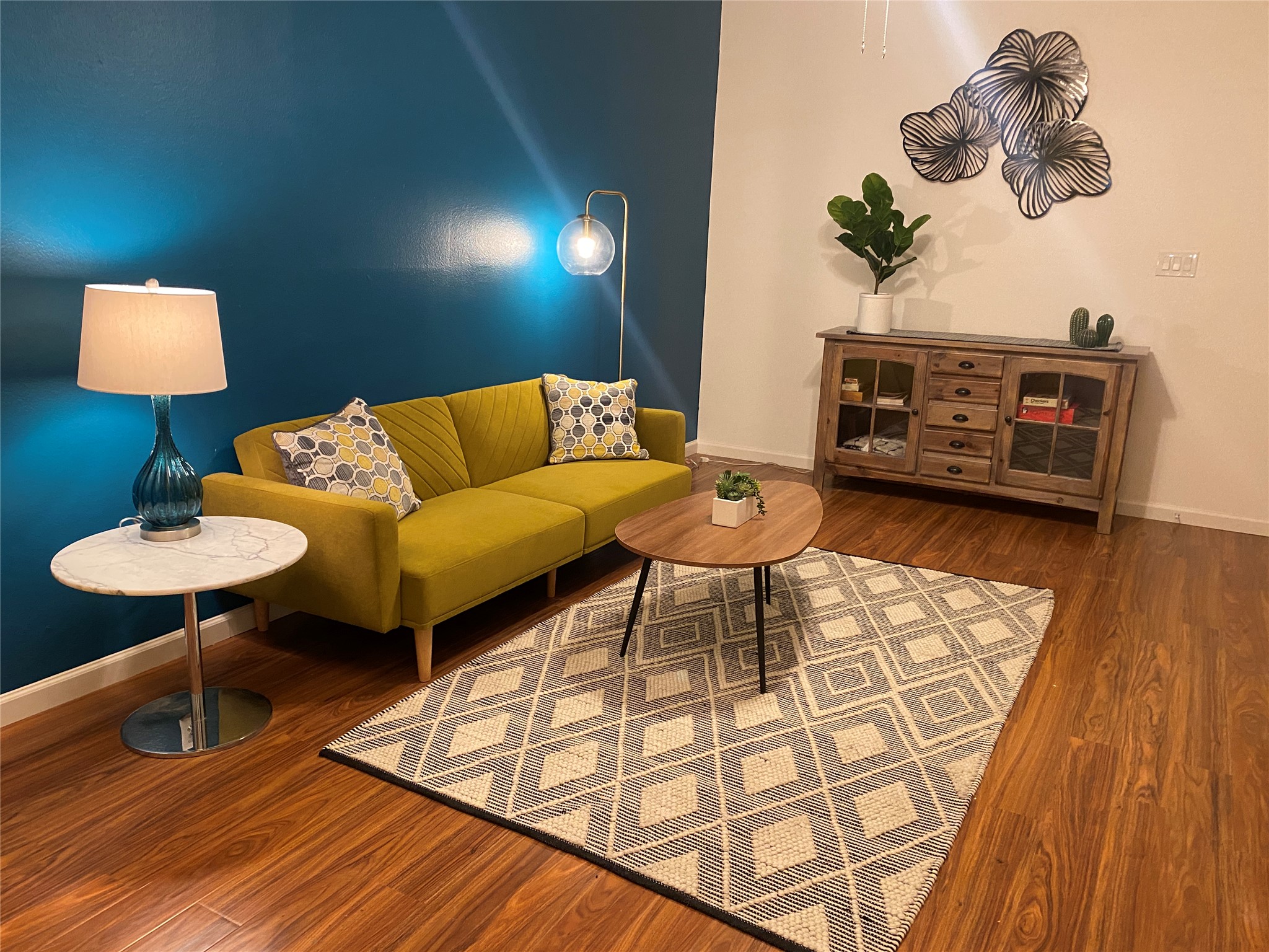 5405 Brompton Circle, Unit B Austin, TX 78745 - Photo 19 of 19 Living room featuring baseboards and wood finished floors