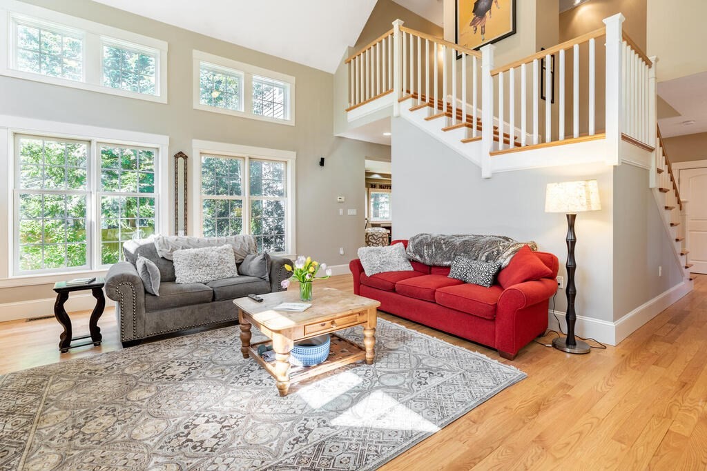 101 Clarke Circle Needham, MA 02492 - Photo 13 of 31 a living room with furniture a couch and a large window