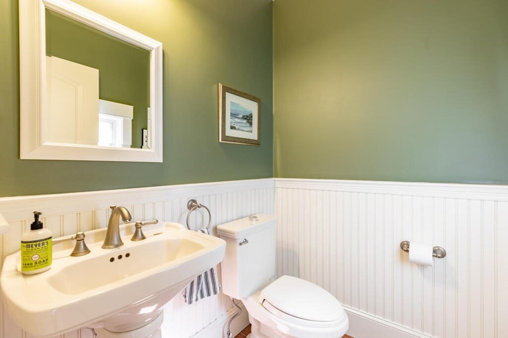 101 Clarke Circle Needham, MA 02492 - Photo 16 of 31 a bathroom with a sink and a mirror