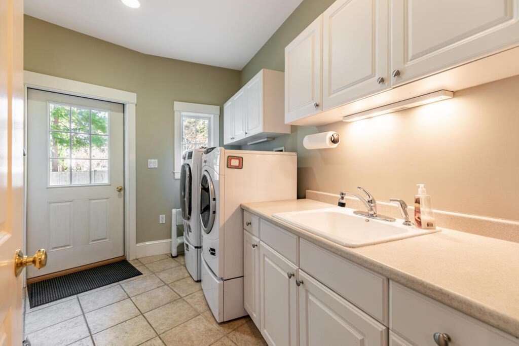 101 Clarke Circle Needham, MA 02492 - Photo 17 of 31 a room with a sink cabinets and utility