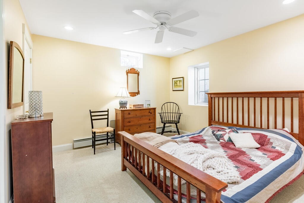 101 Clarke Circle Needham, MA 02492 - Photo 27 of 31 a bed room with a bed and a chair