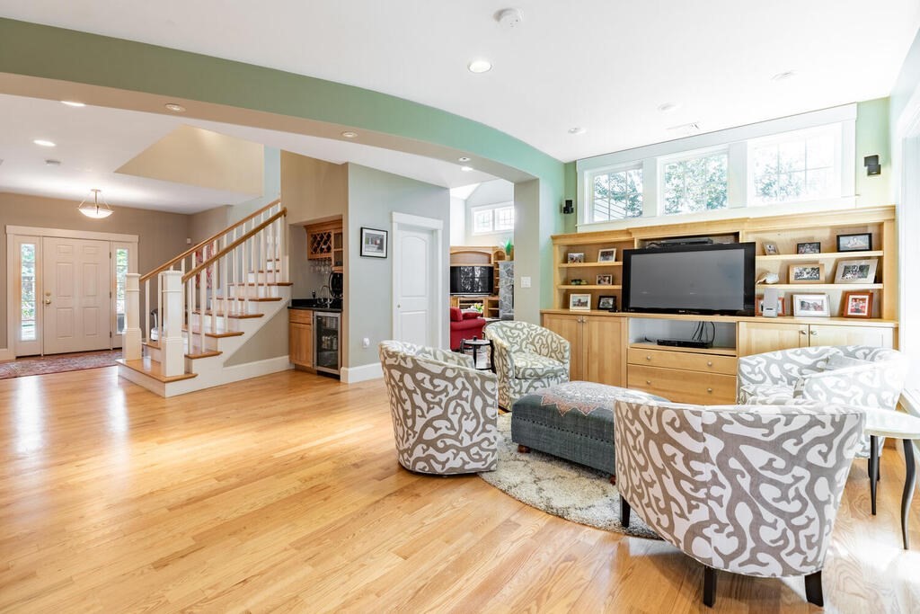 101 Clarke Circle Needham, MA 02492 - Photo 4 of 31 a living room with furniture and a flat screen tv