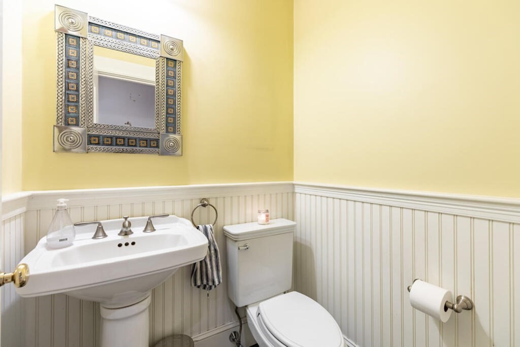 101 Clarke Circle Needham, MA 02492 - Photo 9 of 31 a bathroom with a sink a toilet and mirror