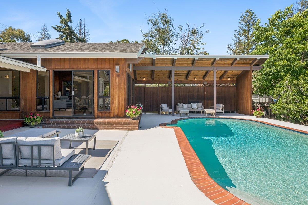 622 Terrace Road San Carlos, CA 94070 - Photo 57 of 83 a view of a patio with couches table and chairs with potted plants and a yard