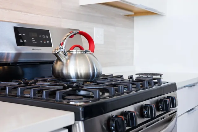 a kitchen with a stove and a microwave