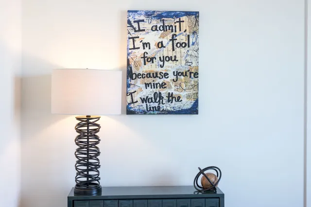 a bathroom with a toilet sink vanity and mirror