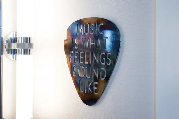 a bedroom with a bed and a large mirror