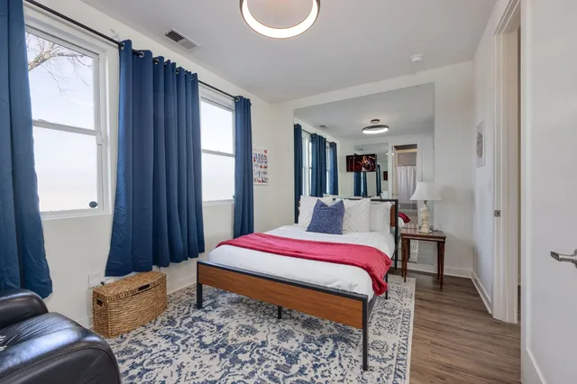 a living room with furniture rug and window