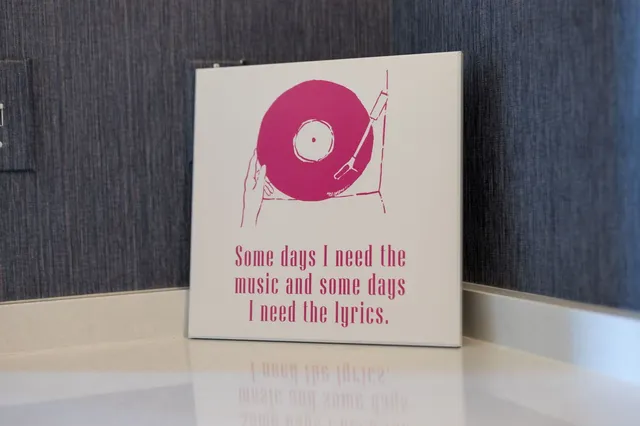 a view of a balcony with chair and wooden floor