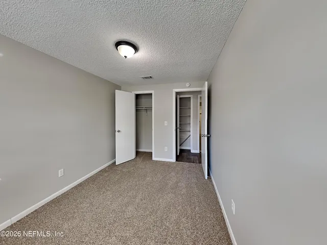 a view of hallway with natural light