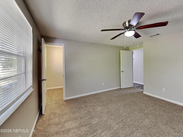 a view of an empty room with a window