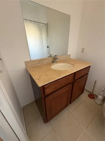 a view of an empty room and wooden floor