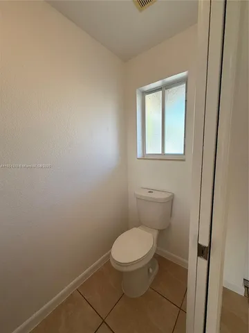 a view of a tree in front of a house