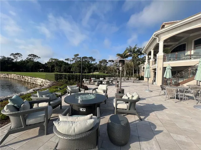 a terrace with outdoor seating and city view