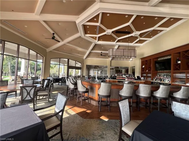 a view of outdoor dining space with a table and chairs