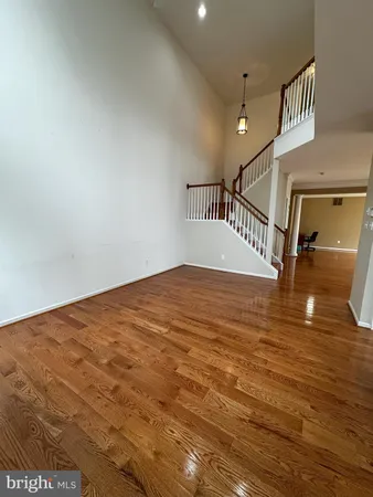 a view of an empty room with stairs