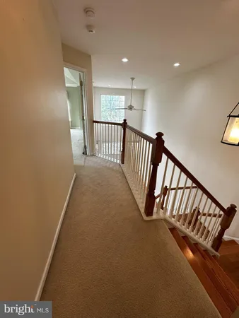 a view of a hallway with windows