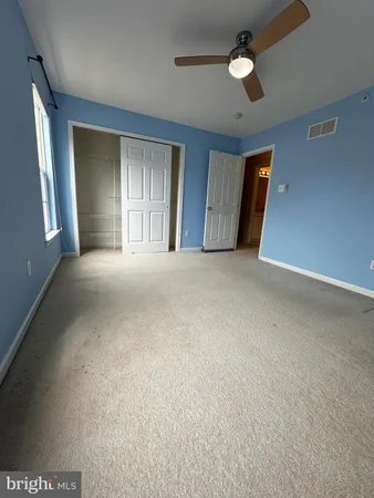 a view of a hallway with a livingroom