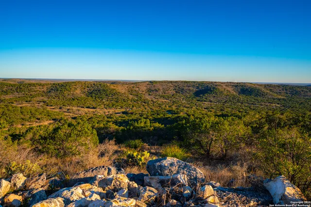 an aerial view of residential building and lake