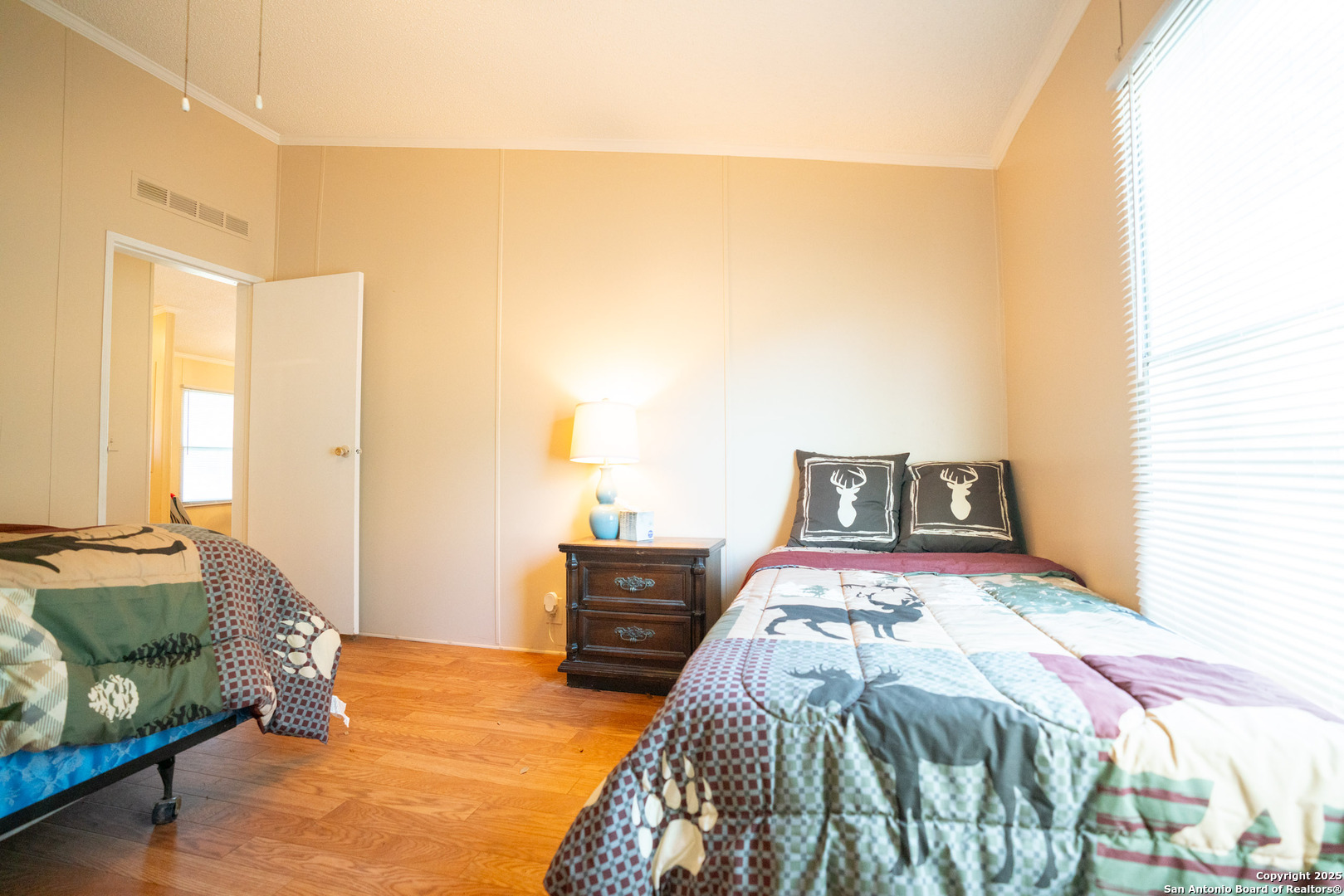 1659 Mesa Verde Sabinal, TX 78881 - Photo 36 of 38 a bedroom with a bed and a mirror
