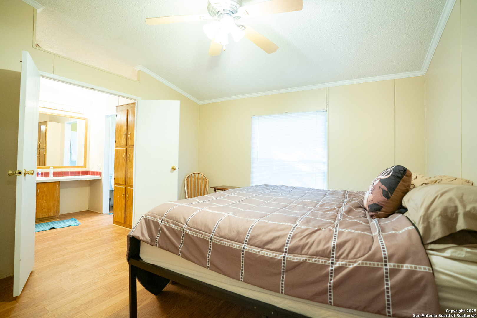 1659 Mesa Verde Sabinal, TX 78881 - Photo 38 of 38 a bedroom with a bed and a chandelier