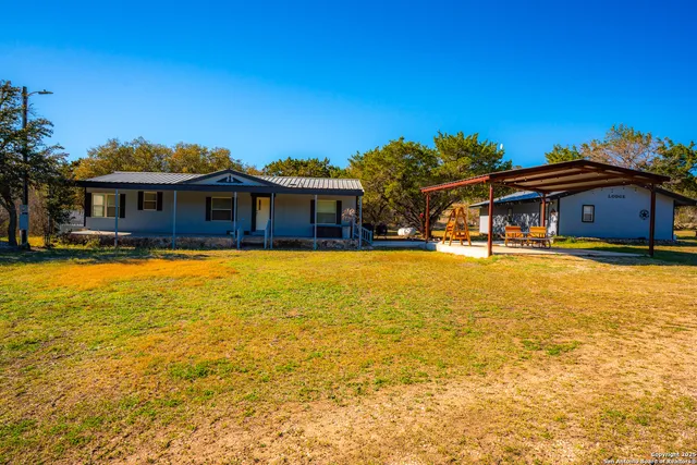 a front view of a house with swimming pool