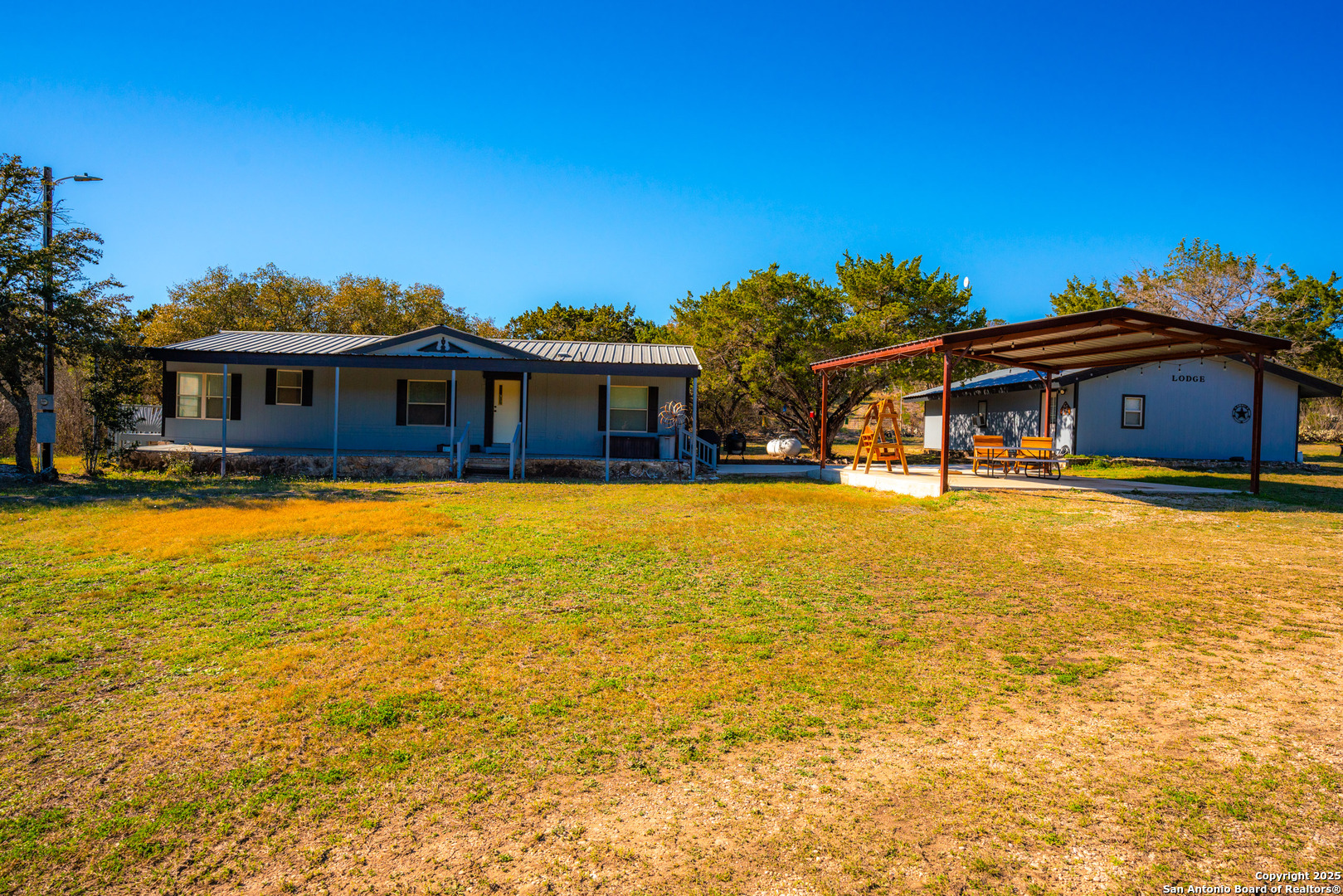 1659 Mesa Verde Sabinal, TX 78881 - Photo 4 of 38 a front view of a house with swimming pool