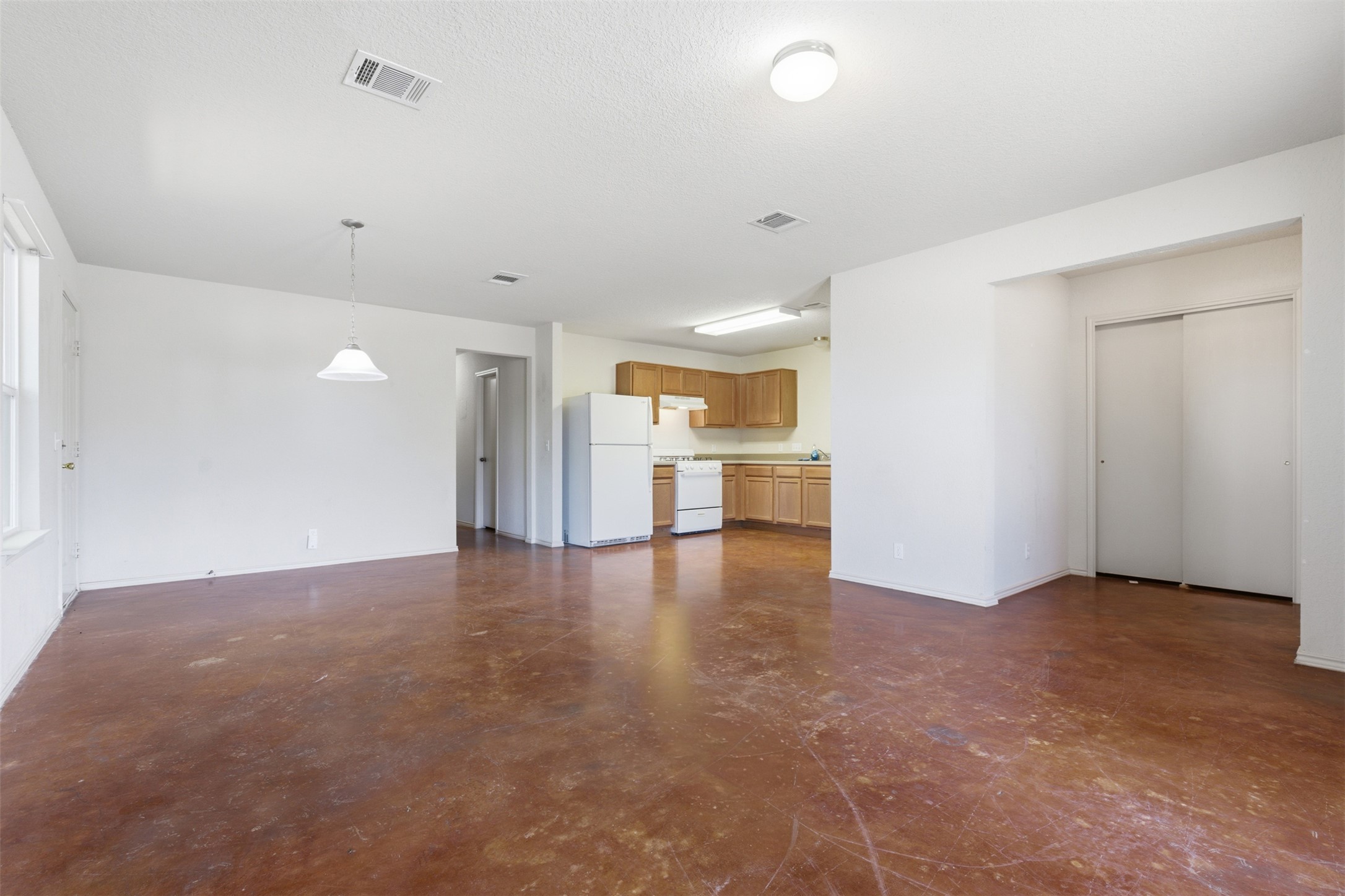 4529 Secure Lane, Unit 31 Austin, TX 78725 - Photo 9 of 38 a view of empty room with a kitchen