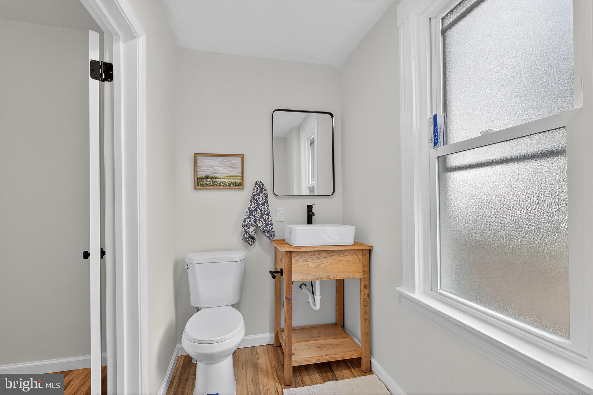 623 East Chestnut Street Lancaster, PA 17602 - Photo 20 of 58 a bathroom with a toilet a sink and mirror