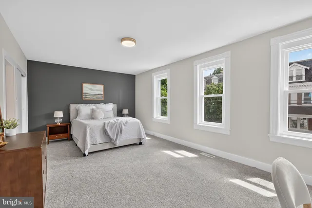 a room with a sink and a mirror