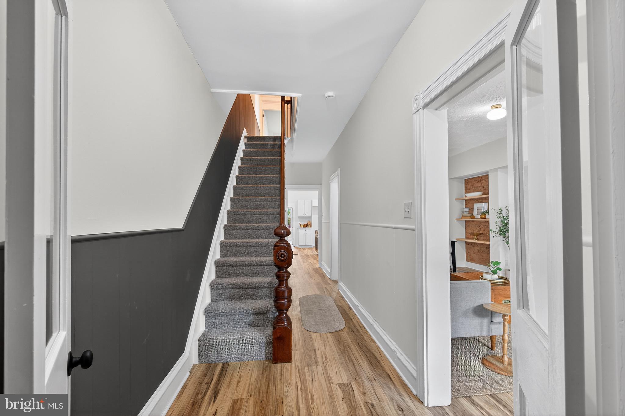 623 East Chestnut Street Lancaster, PA 17602 - Photo 7 of 58 a view of staircase with wooden floor and white walls