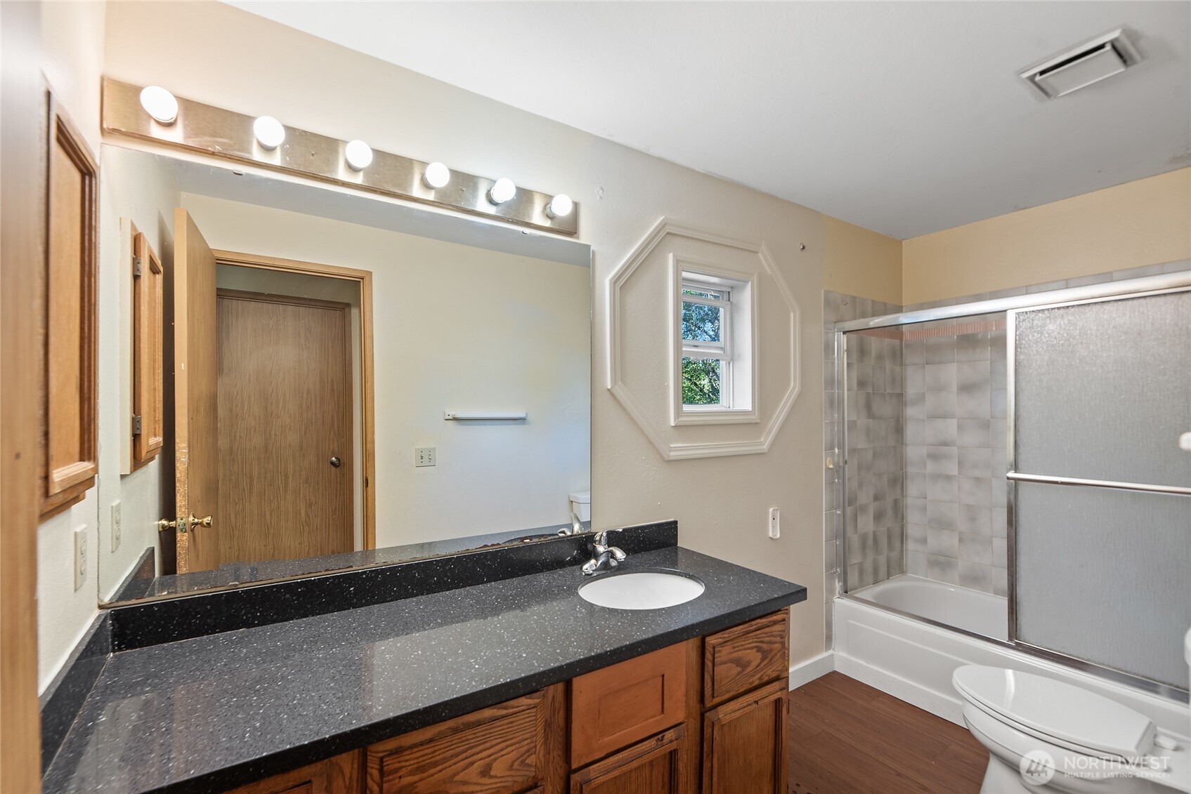 10606 68th Place South Seattle, WA 98178 - Photo 17 of 31 a bathroom with a sink and a mirror