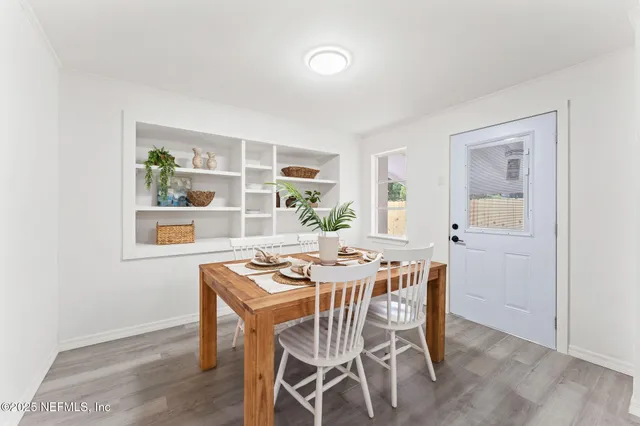 a dining room with furniture and window