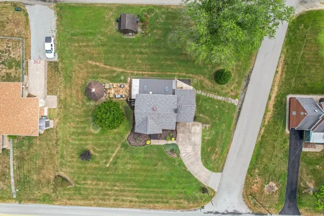 an aerial view of a house with outdoor space swimming pool
