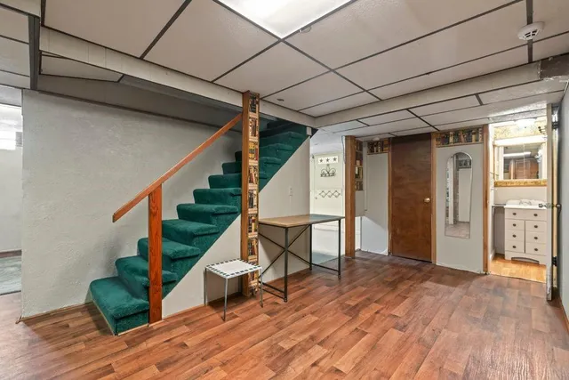 a view of entryway with wooden floor and stairs