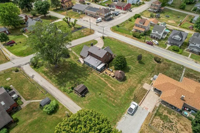 an aerial view of a residential houses with outdoor space