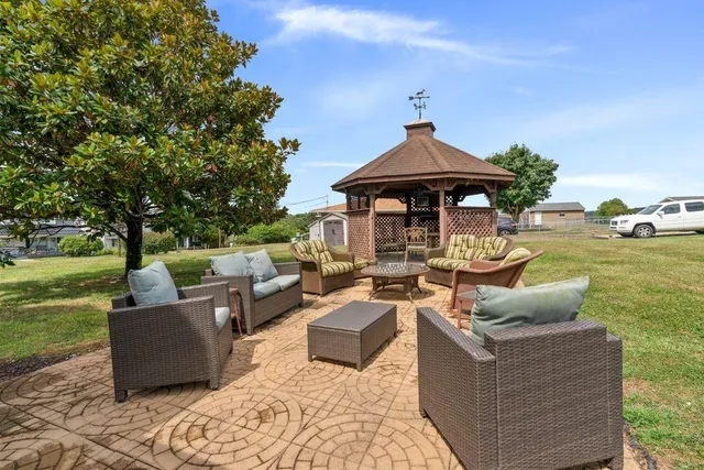 a living room with furniture and a yard