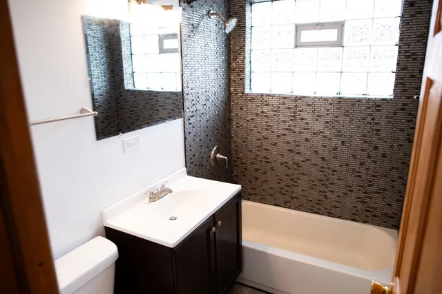 a bathroom with a sink and a bathtub