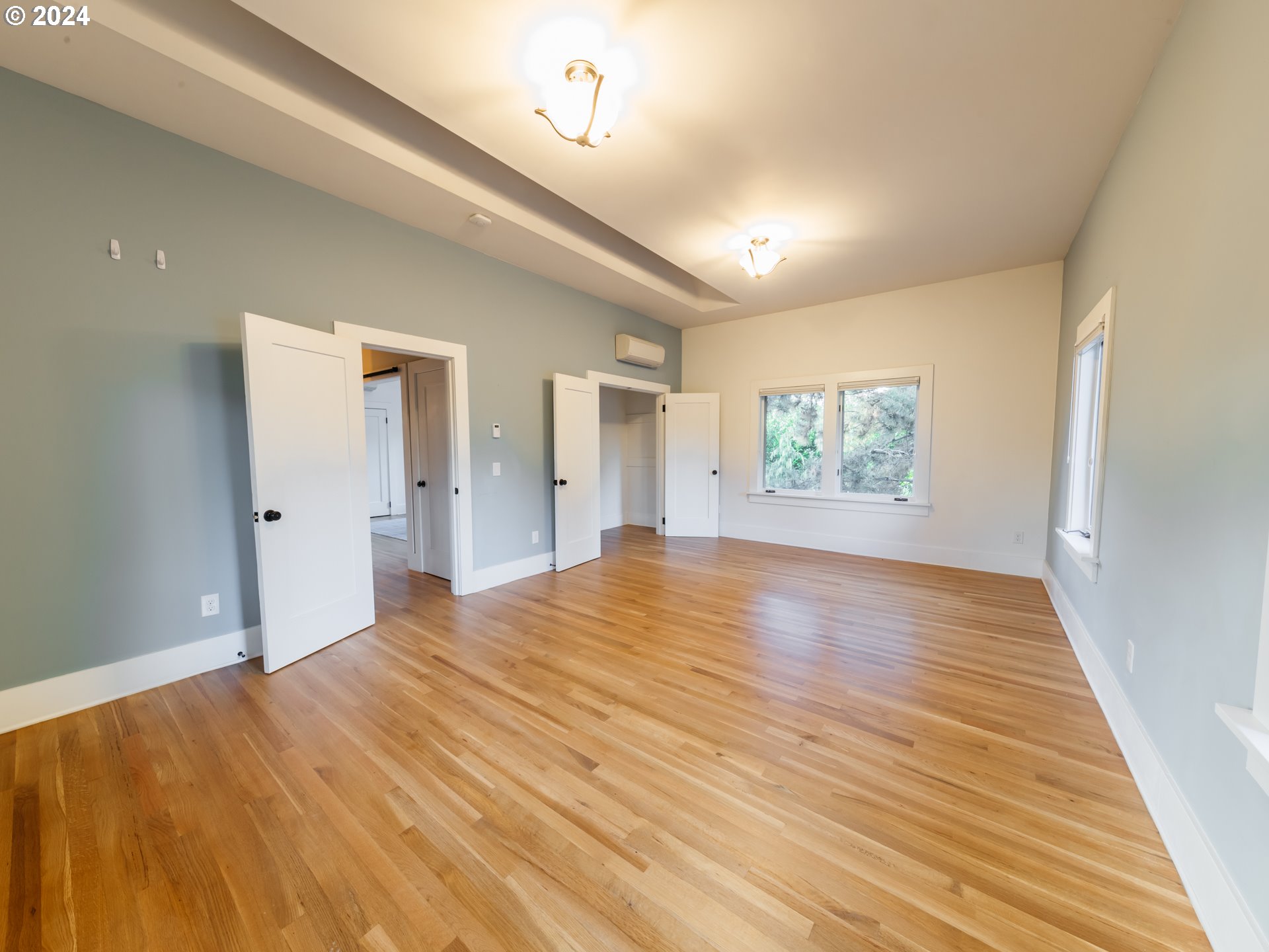 3117 Southeast Brooklyn Street Portland, OR 97202 - Photo 19 of 39 a view of empty room with wooden floor
