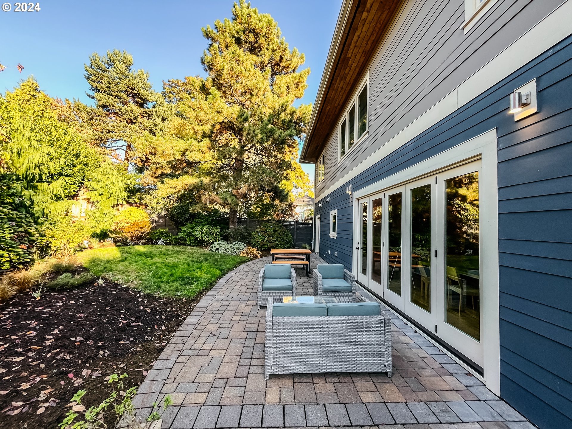 3117 Southeast Brooklyn Street Portland, OR 97202 - Photo 36 of 39 a view of a patio with table and chairs and potted plants