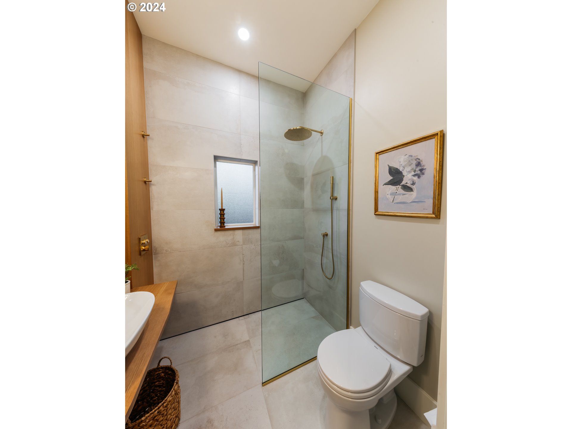 3117 Southeast Brooklyn Street Portland, OR 97202 - Photo 10 of 39 a white toilet sitting next to a bathroom sink and a shower