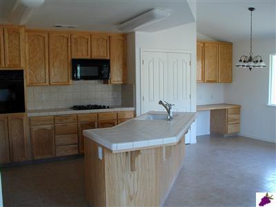 32276 Sycamore Road Tollhouse, CA 93667 - Photo 3 of 12 Modern Kitchen with lovely tile countertops and oak cabinets and pantry.
