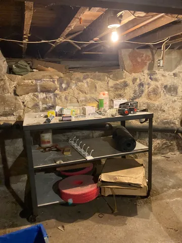 a view of a building with retail shops and traffic signal